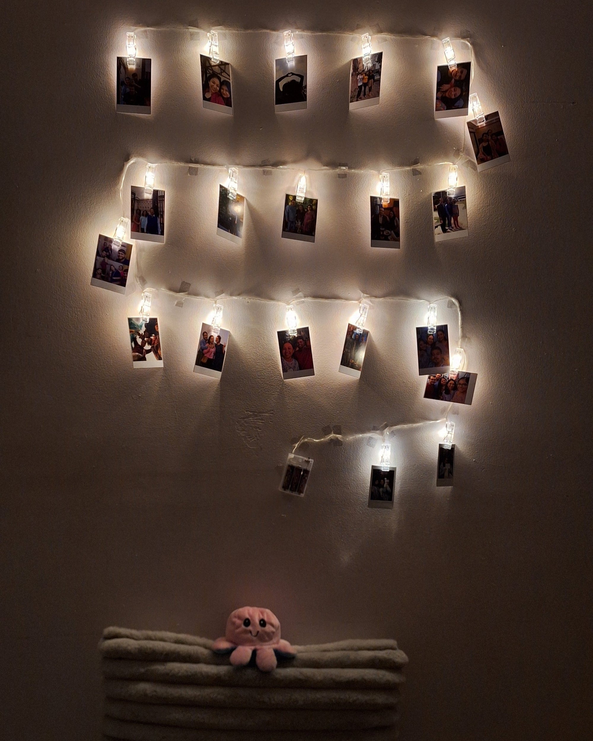 Set of 48 premium Polaroids, printed on high gloss paper, displaying your favorite moments in a vibrant, nostalgic display of memories on the wall.