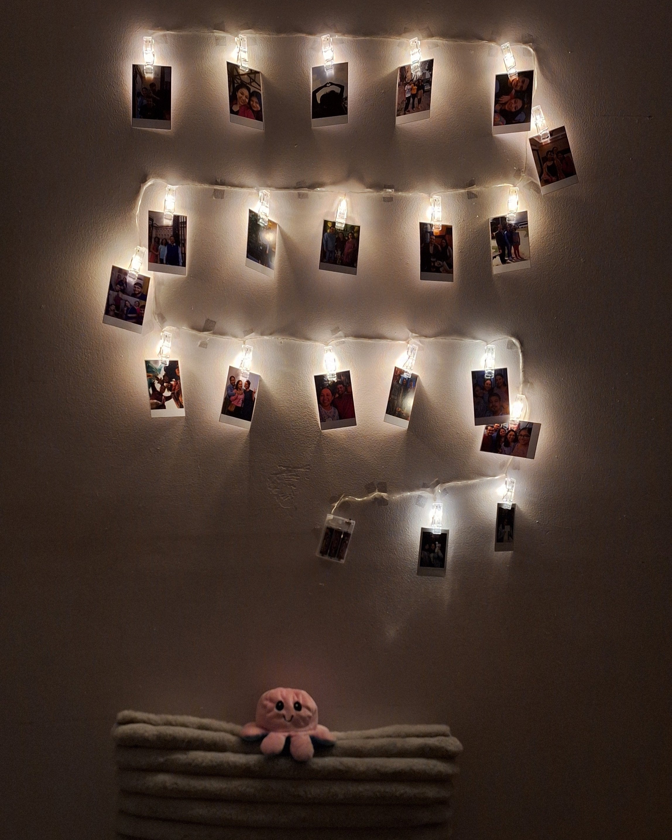 Set of 48 premium Polaroids, printed on high gloss paper, displaying your favorite moments in a vibrant, nostalgic display of memories on the wall.