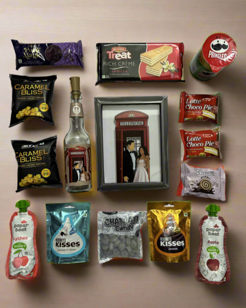 Premium Wedding Trousseau featuring personalised DopaMean bottles, custom Classic Frame, handcrafted cane basket, and assorted premium snacks, making the perfect wedding gift.