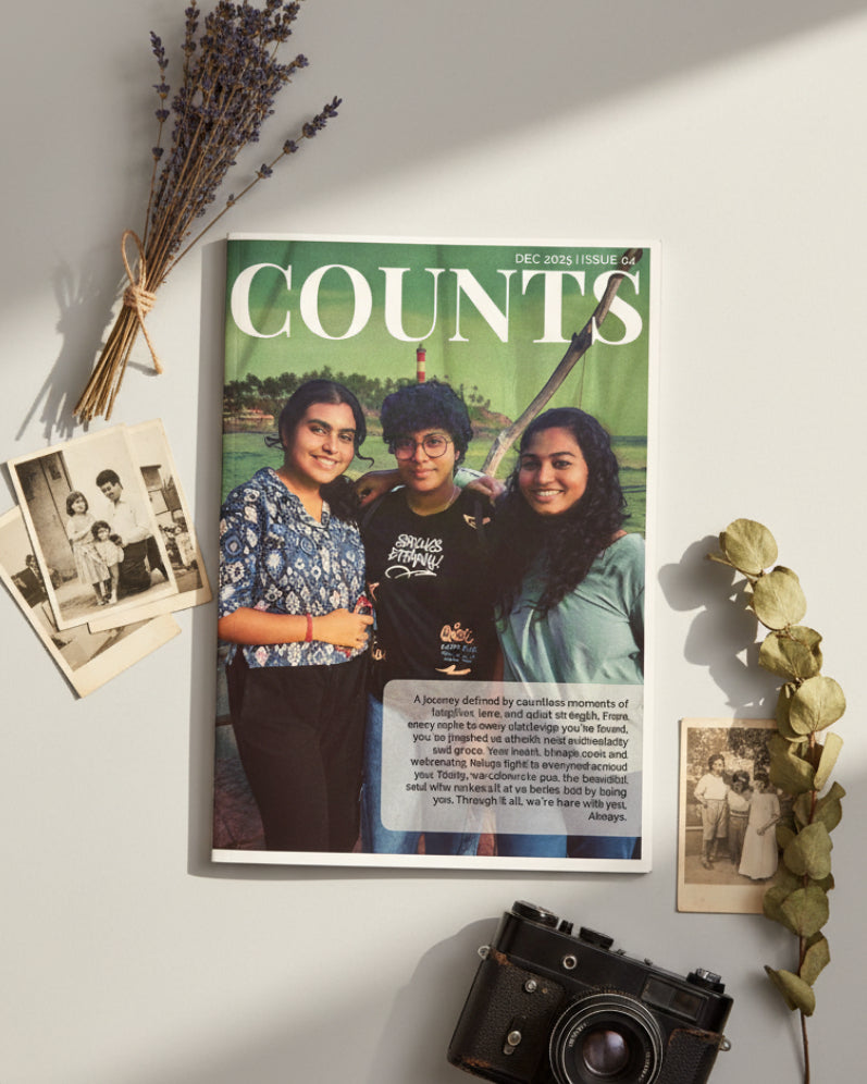 Magazine with a cover featuring two people on a red floral background