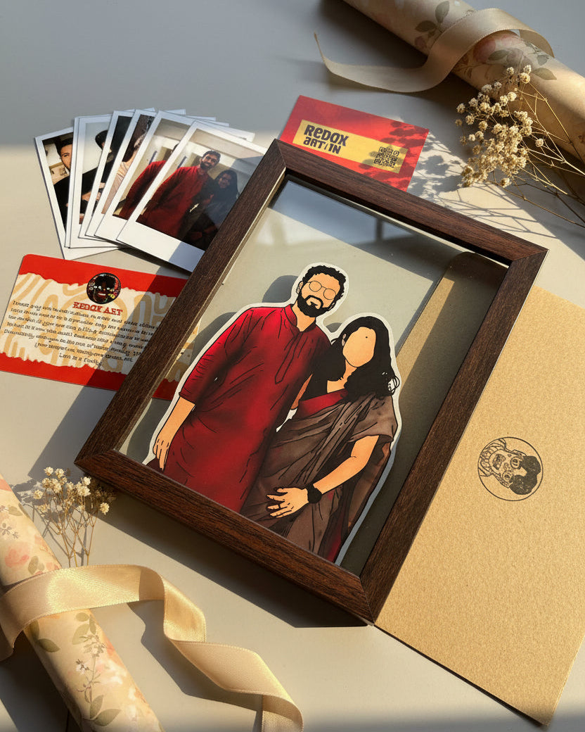 Framed illustration of a couple on a cutting mat with additional prints.