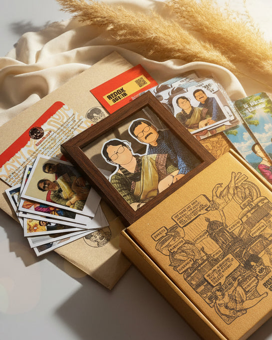 Illustrated Frame with Collection of Polaroids and a cardboard box on a wooden surface